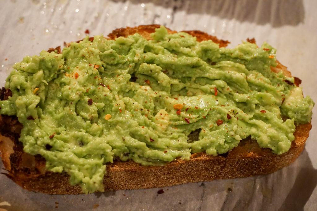 the basic *itch avocado toast with red pepper flakes 