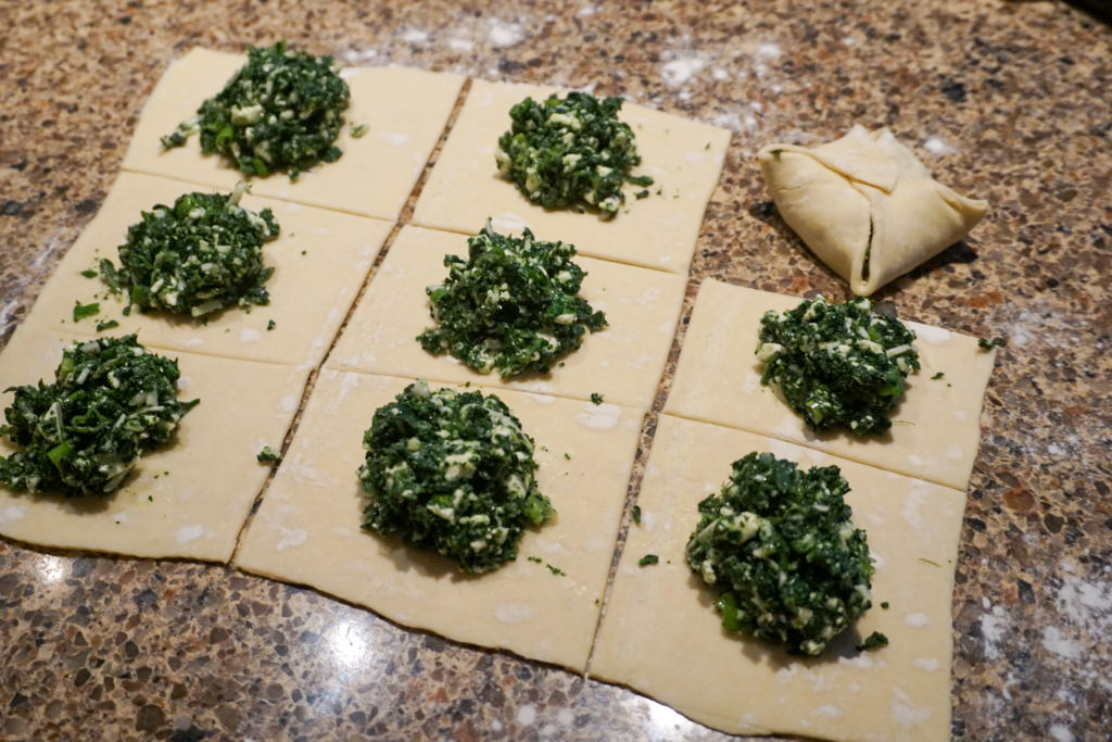 folding the spinach puffs 