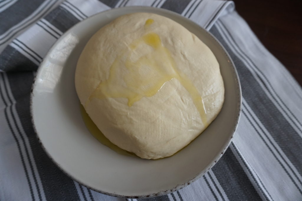 Dough with few tablespoons of olive oil resting before use. 