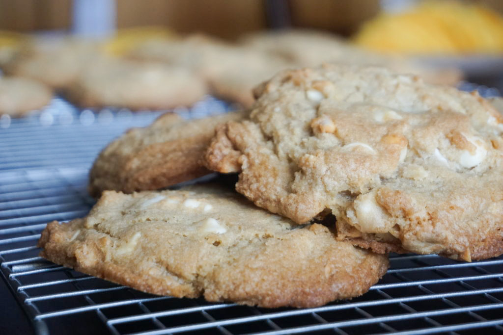 white chocolate chip macadamia nut cookies on a cooling rack