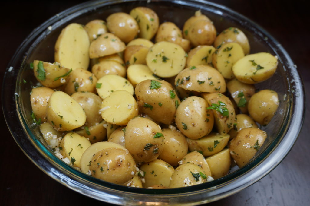 Garlic potatoes coated in kosher salt, garlic, olive oil, ground black pepper, and parsley.