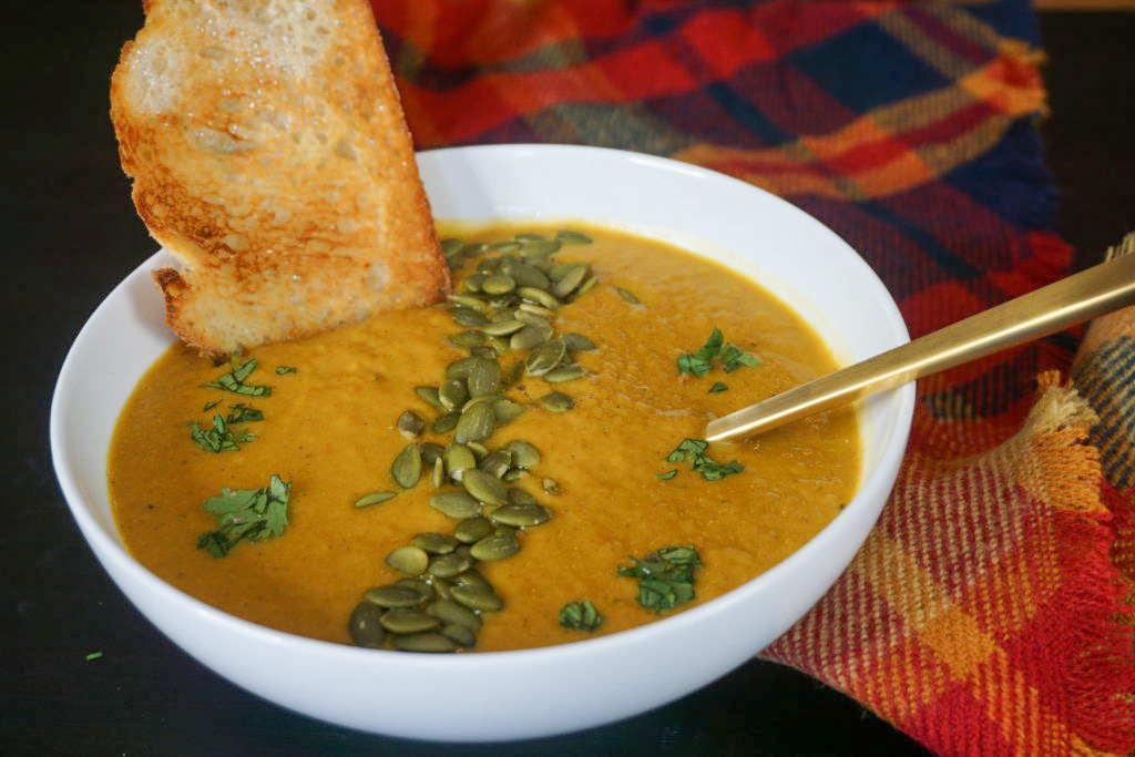 close-up of vegan pumpkin soup with bread