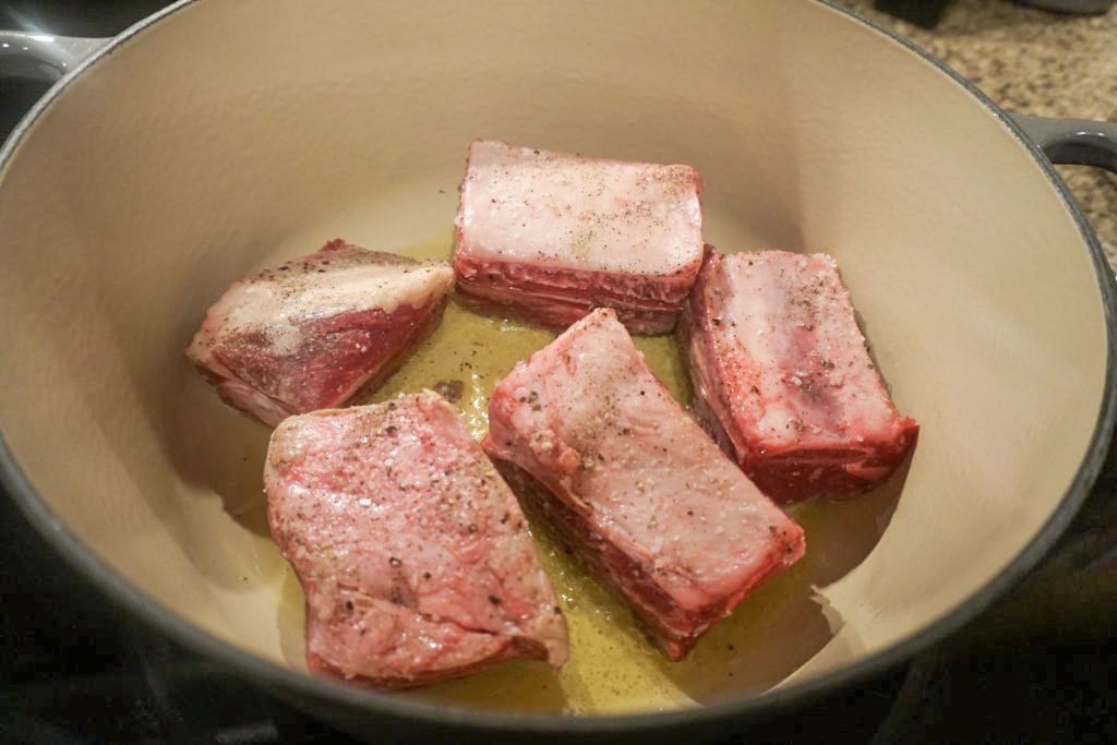 Quickly searing the short ribs on all sides