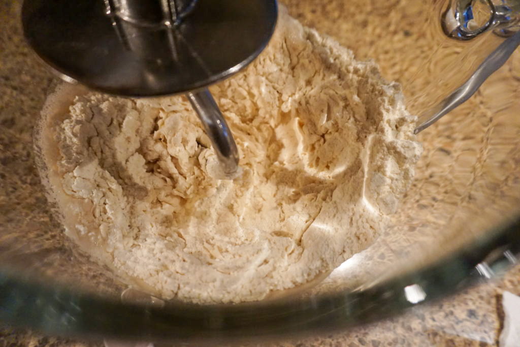 Mixing the all-purpose flour, salt, and yeast together 