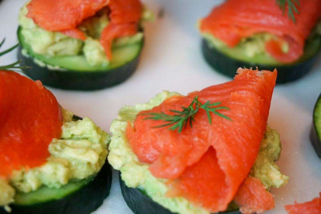 Close-up of the smoked salmon with avocado, cucumber, and dill 