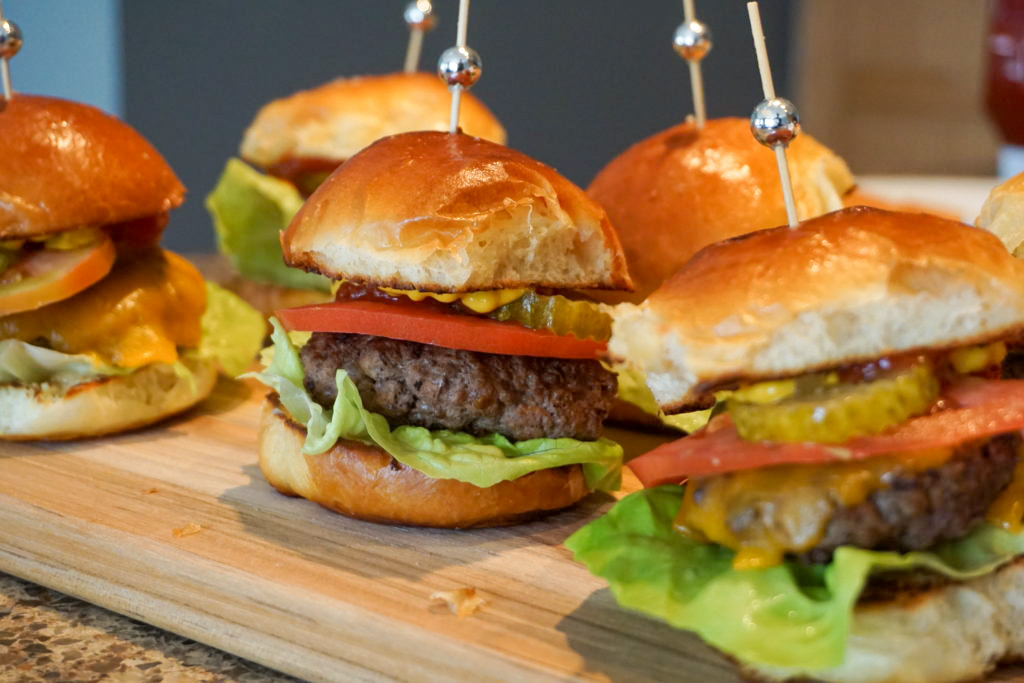 Sliders on bamboo serving board