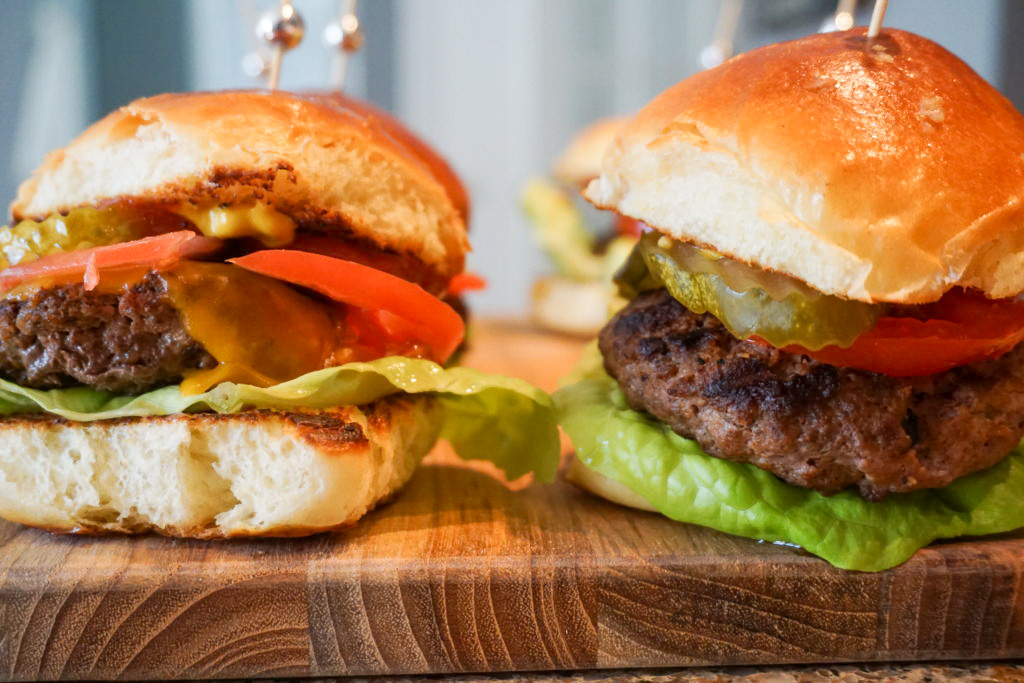 close-up of cheeseburger and hamburger sliders