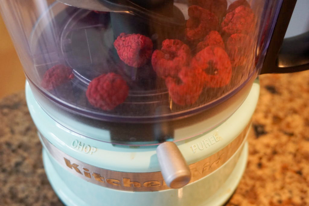 Using a food processor to grind the freeze-dried raspberries