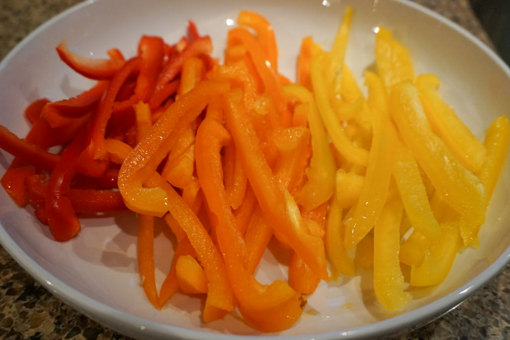 raw orange, yellow, and red bell peppers