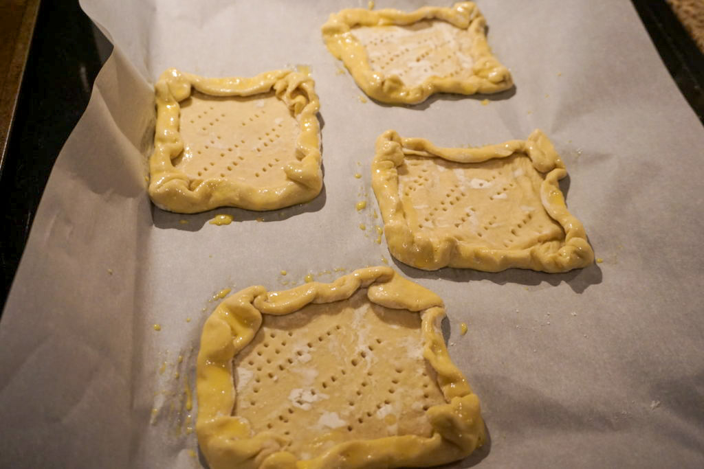 poking holes all over the puff pastry with a fork 