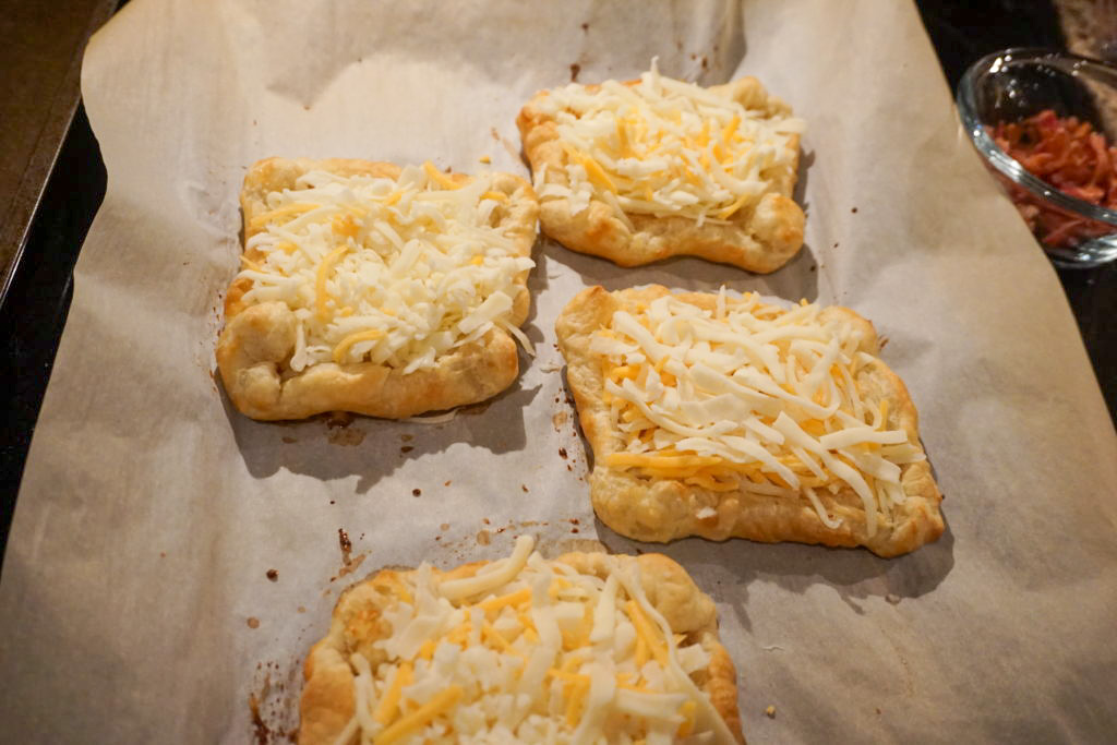 adding cheese to the tart 