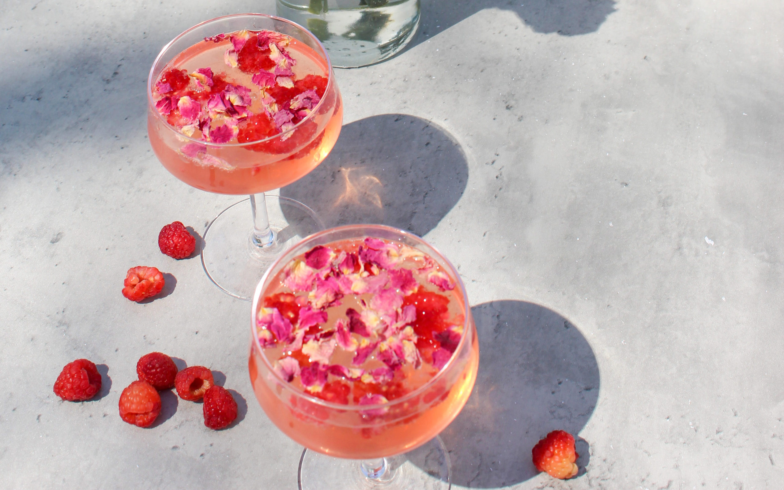 the garden rose cocktail with flowers and raspberries 