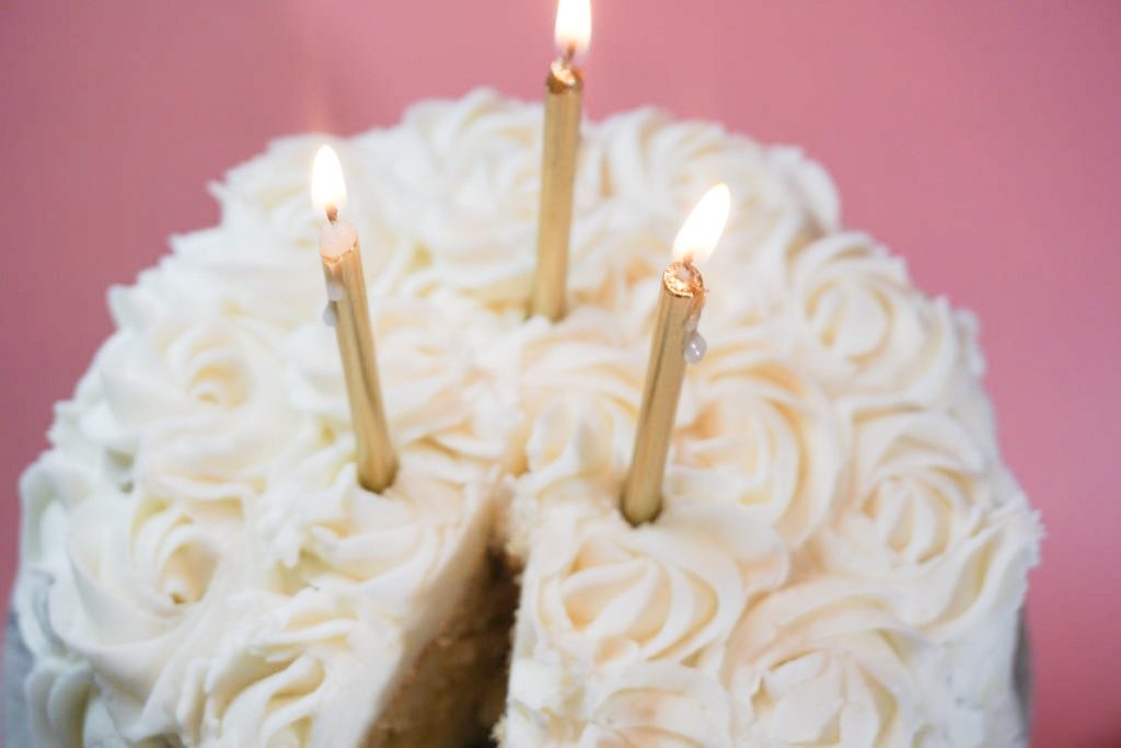 Close up of the cake, frosting, with birthday candles 