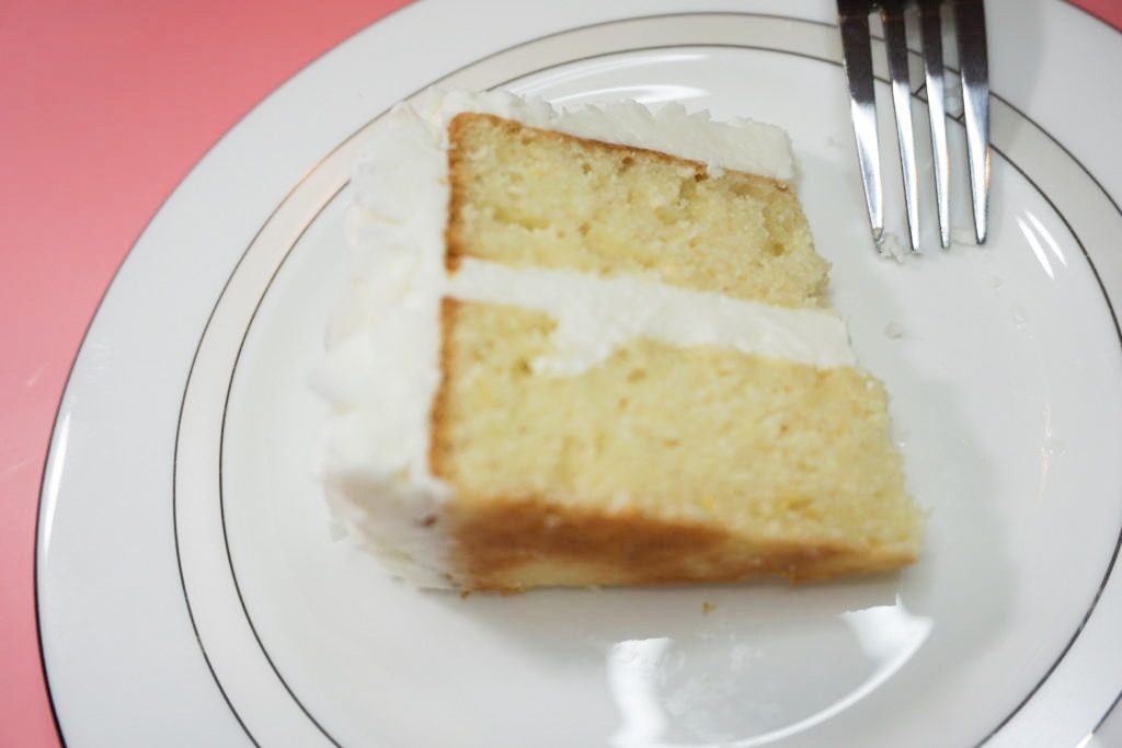 Slice of lemon cake with the lemon buttercream
