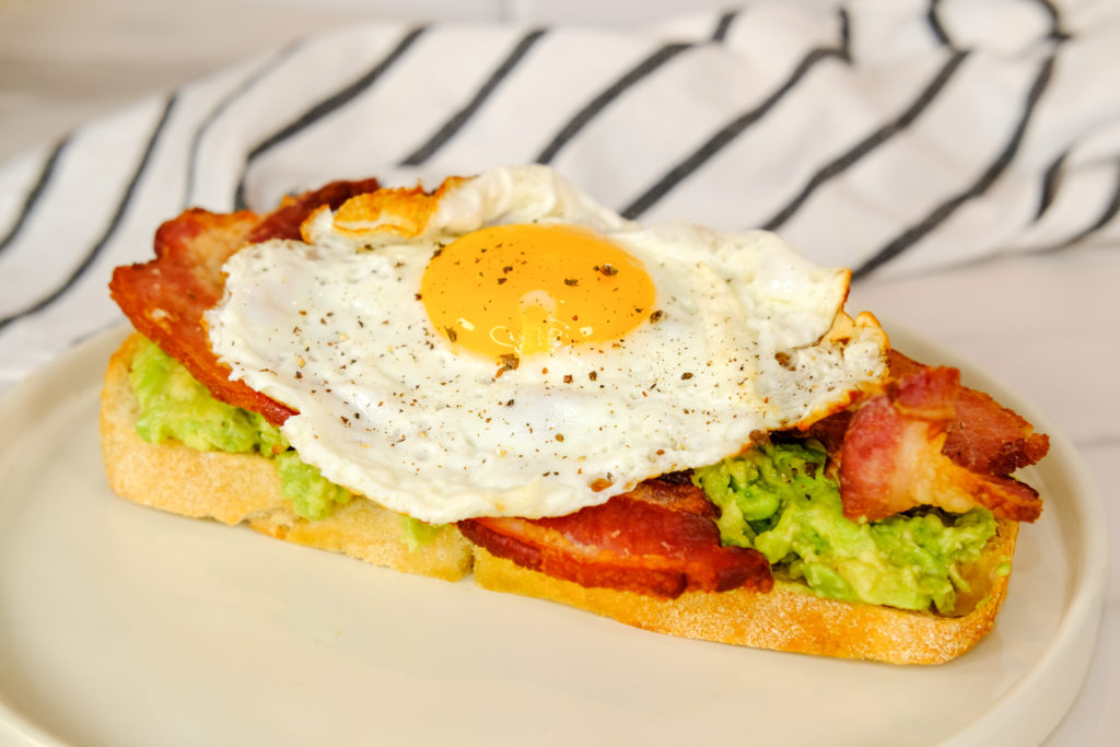 mashed avocado, bacon, and egg toast 